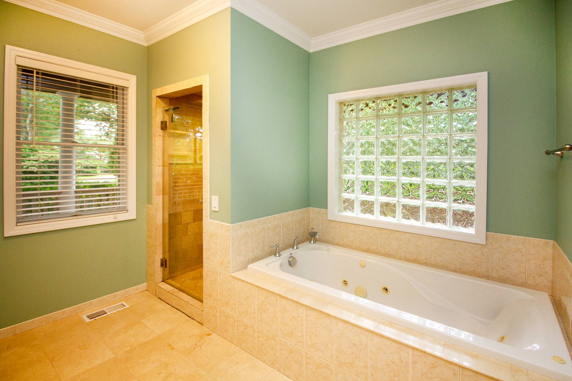 49 Bridle Path Westhampton Beach, NY 11978 - Photo 11 of 29 a bathroom with a bathtub and a shower