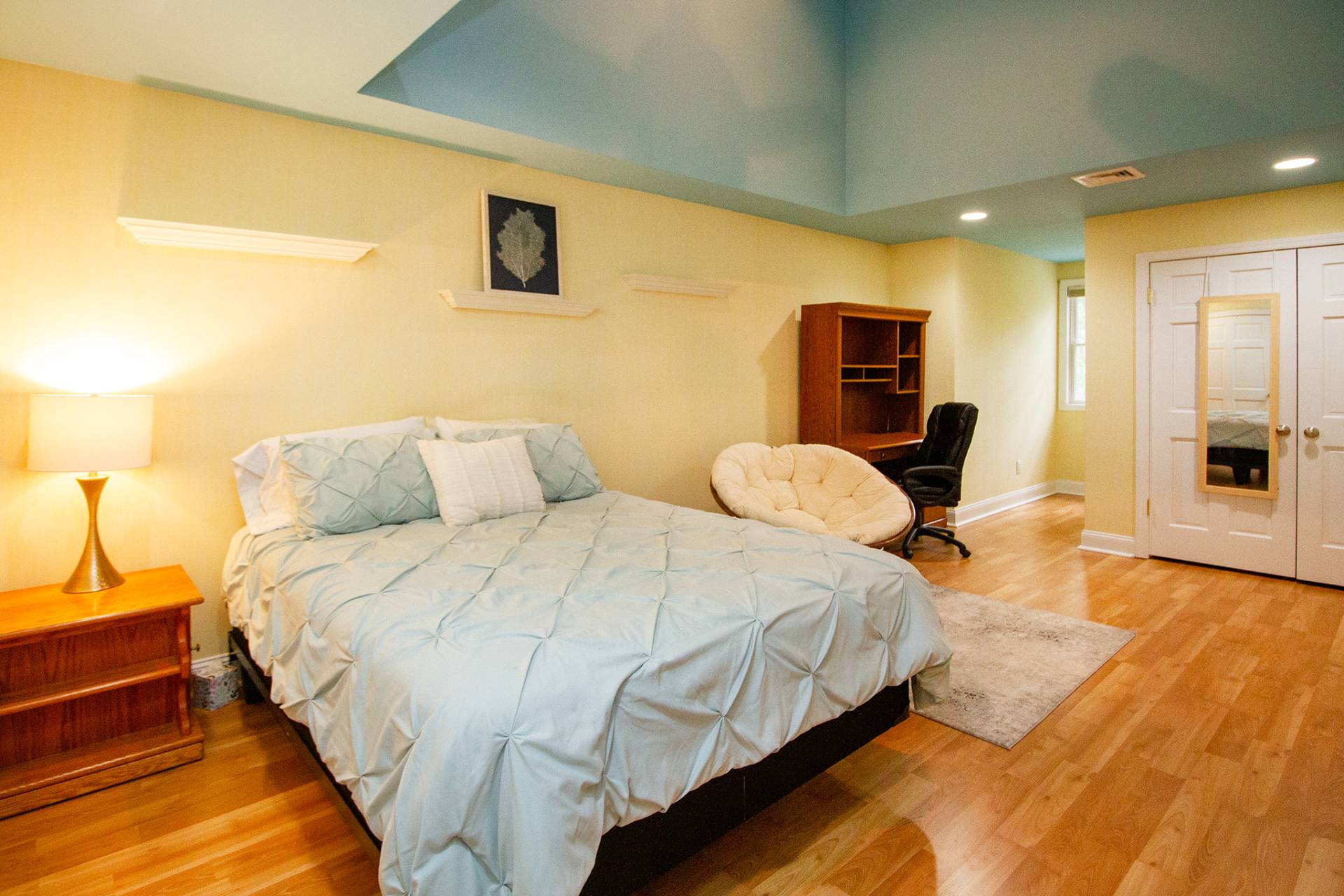 49 Bridle Path Westhampton Beach, NY 11978 - Photo 18 of 29 a bedroom with bed and wooden floor