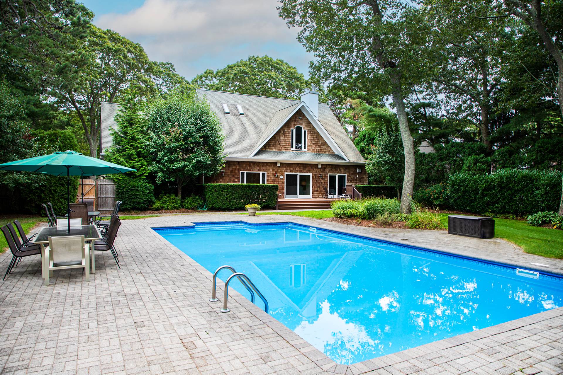 49 Bridle Path Westhampton Beach, NY 11978 - Photo 2 of 29 a view of a house with swimming pool and sitting area