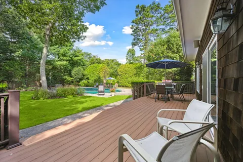a view of a backyard with sitting area