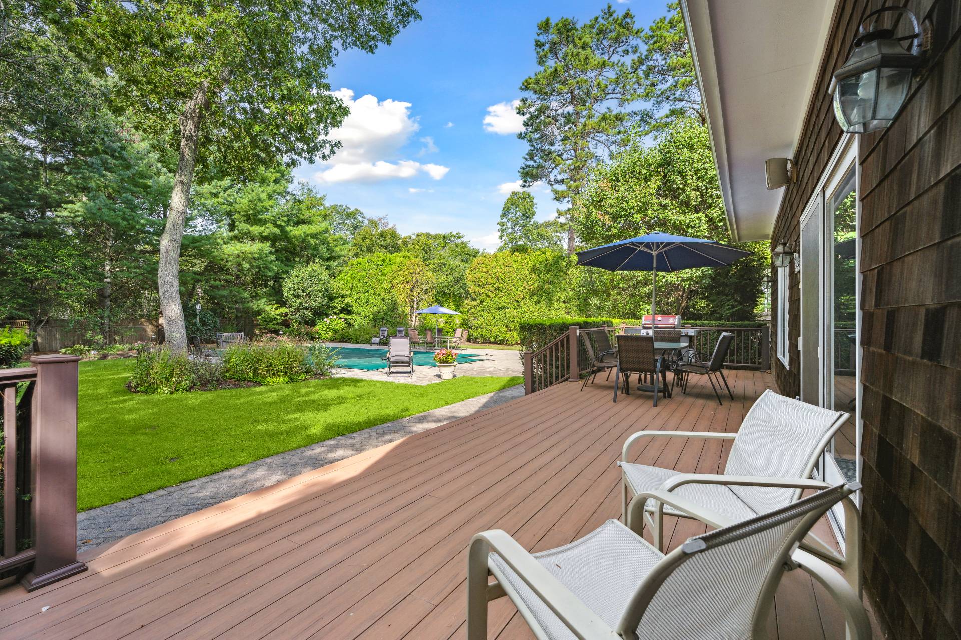 49 Bridle Path Westhampton Beach, NY 11978 - Photo 24 of 29 a view of a backyard with sitting area