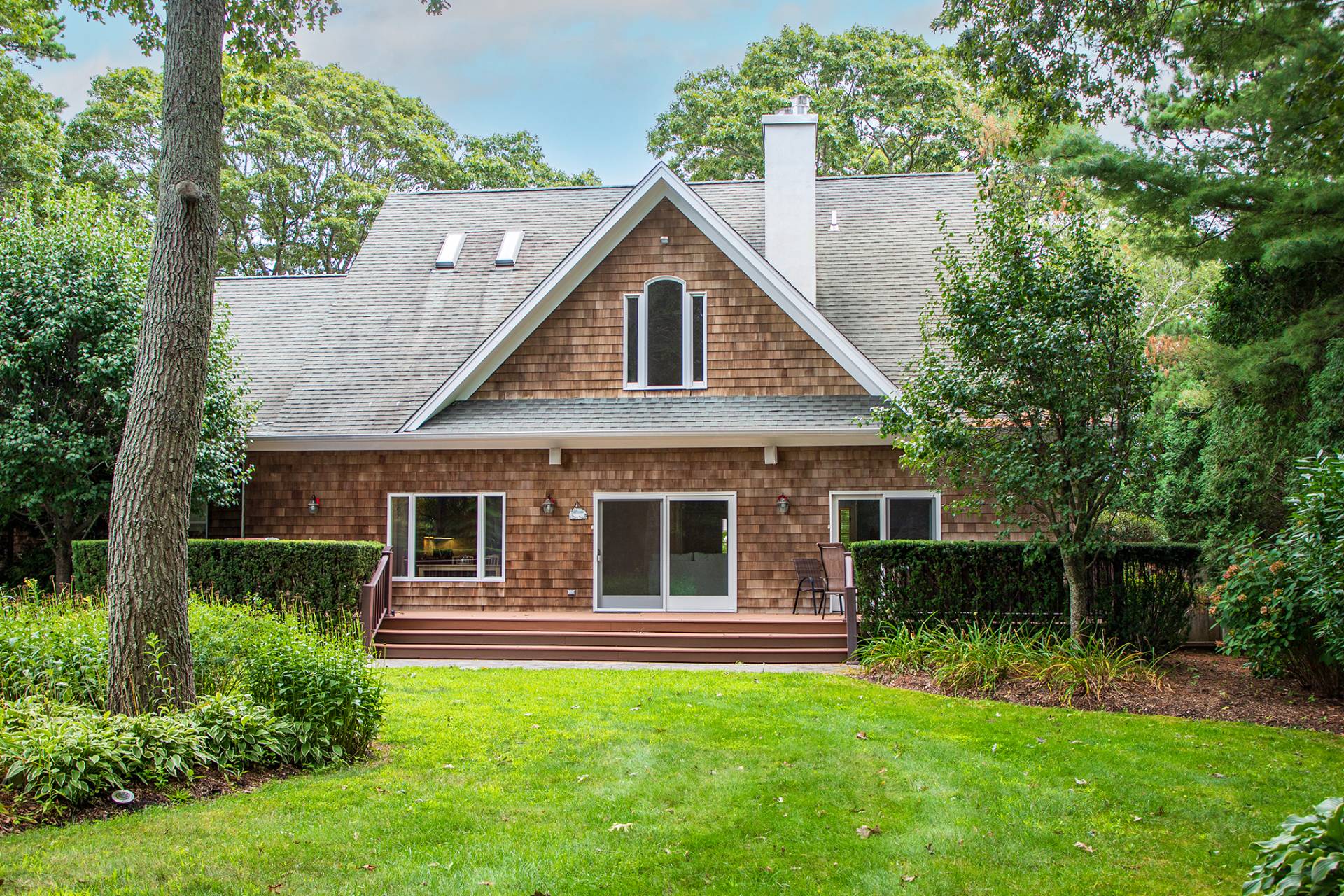 49 Bridle Path Westhampton Beach, NY 11978 - Photo 28 of 29 a house view with a garden space