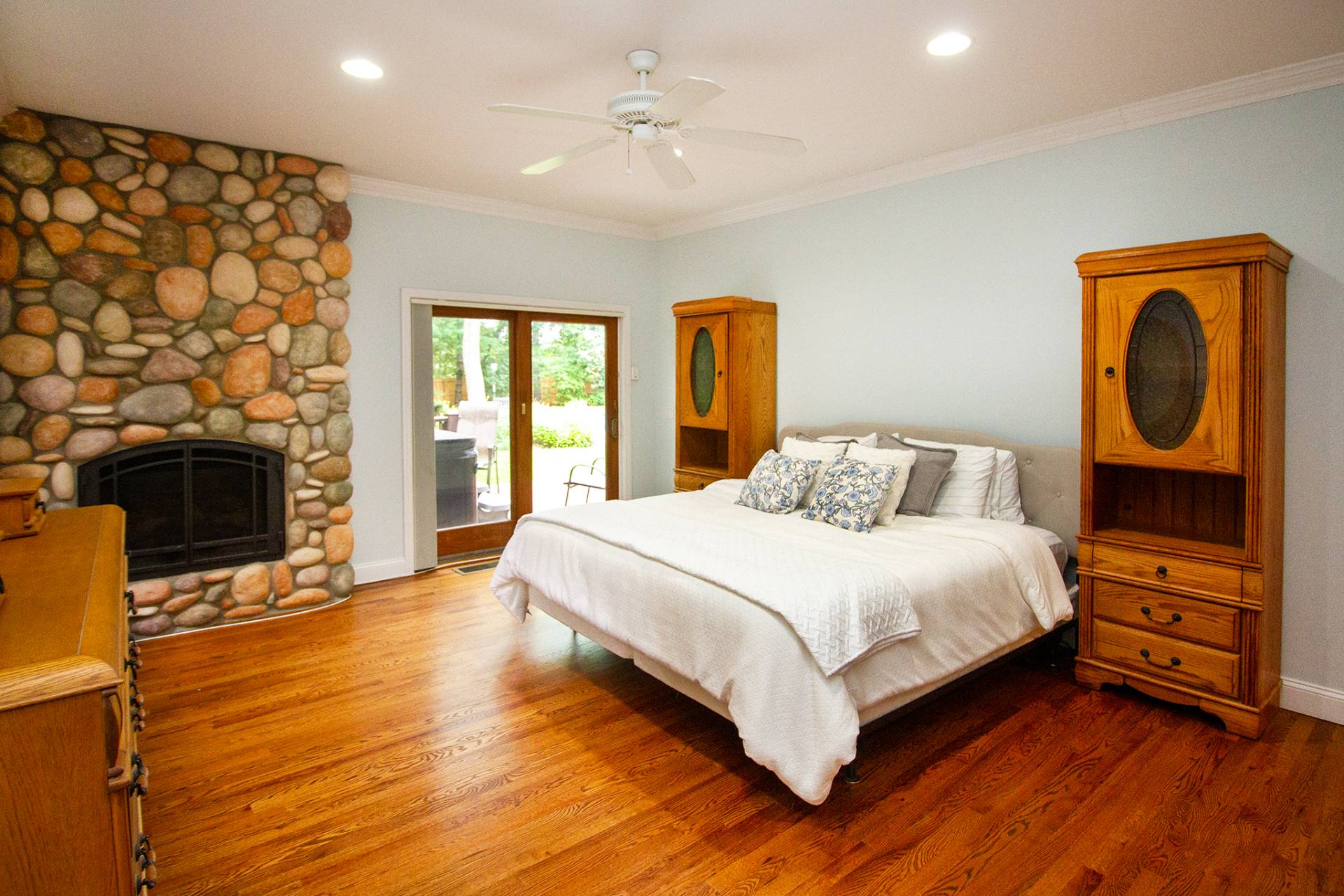 49 Bridle Path Westhampton Beach, NY 11978 - Photo 10 of 29 a bedroom with a bed and a fireplace