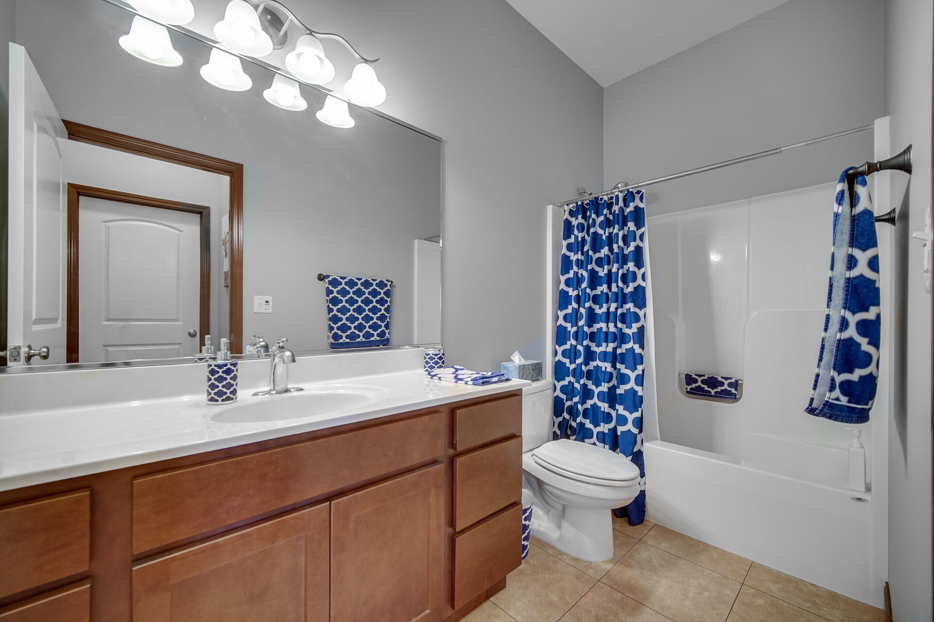123 North Main Street, Unit 301 Crown Point, IN 46307 - Photo 14 of 25 a bathroom with a sink a toilet and a mirror