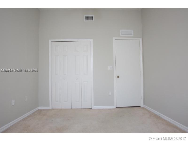 1251 Southeast 27th Street, Unit 204 Homestead, FL 33035 - Photo 8 of 11 a view of an empty room