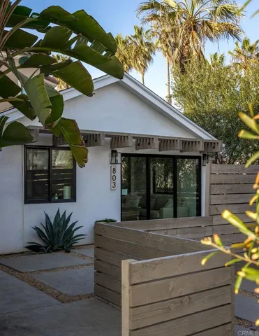 a view of living room kitchen with furniture and floor to ceiling window