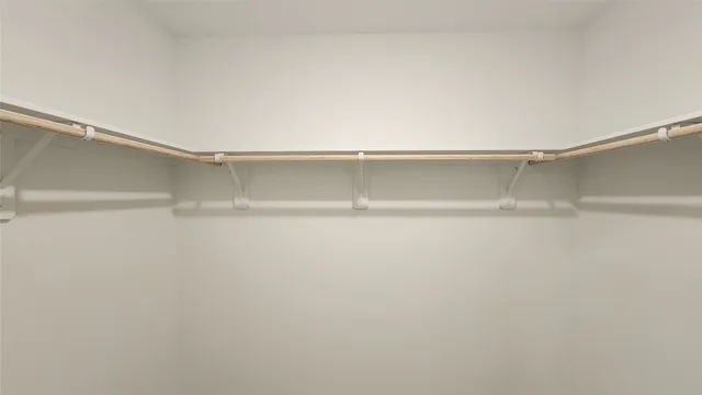 a view of a hallway with a white walls