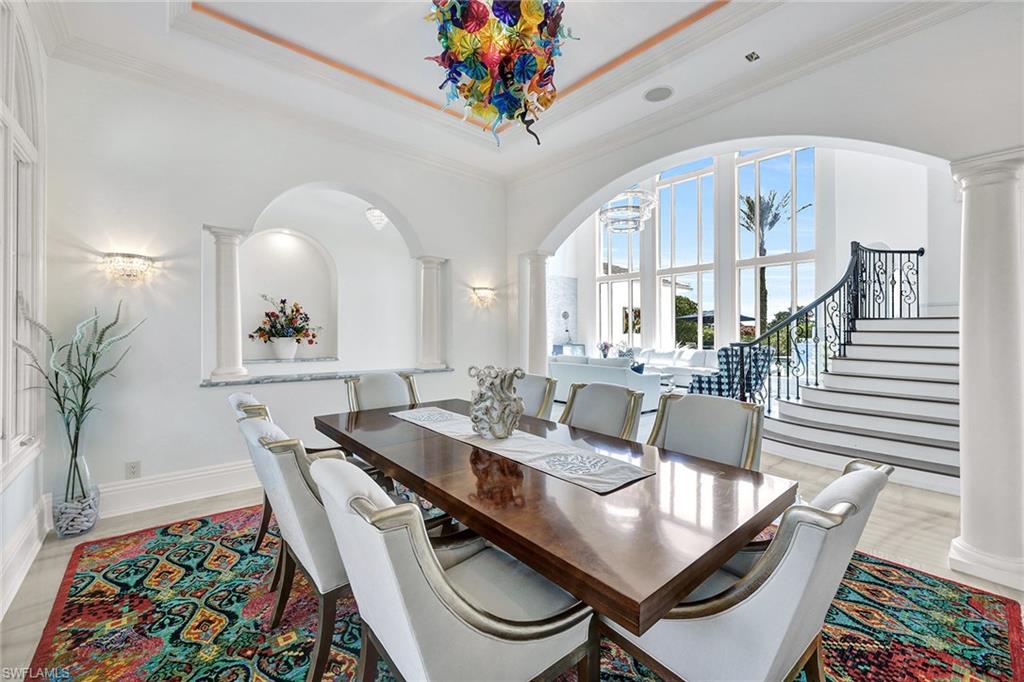 16770 Prato Way Naples, FL 34110 - Photo 12 of 29 a view of a dining room with furniture and a potted plant