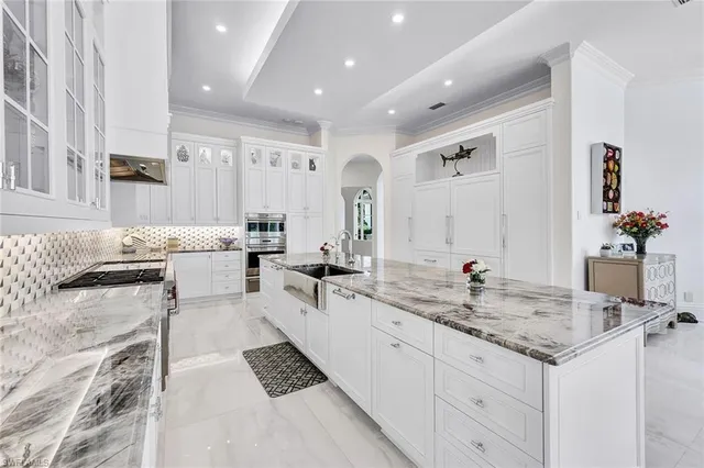 a spacious bathroom with sinks mirror and