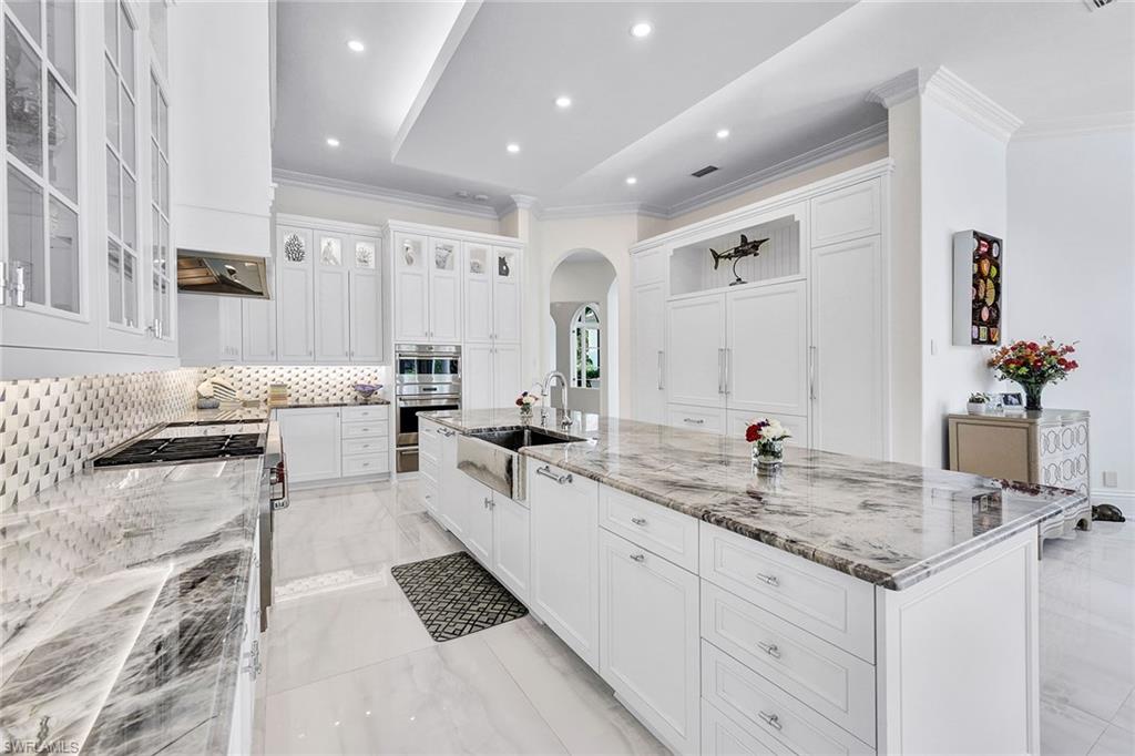 16770 Prato Way Naples, FL 34110 - Photo 7 of 29 a spacious bathroom with sinks mirror and