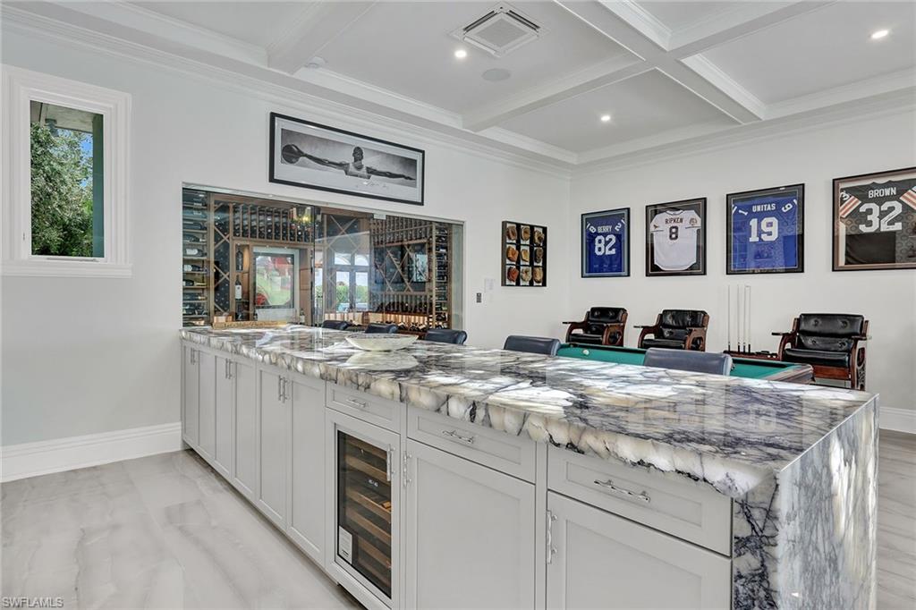 16770 Prato Way Naples, FL 34110 - Photo 10 of 29 a view of living room with granite countertop furniture and painting on the wall