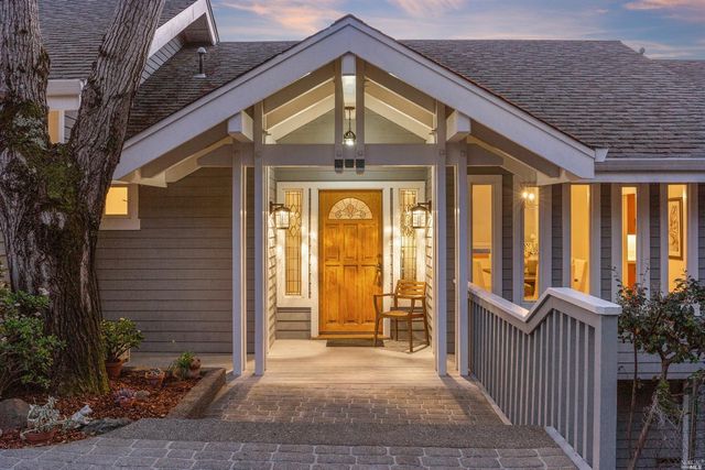 a view of a house with wooden floor and fence