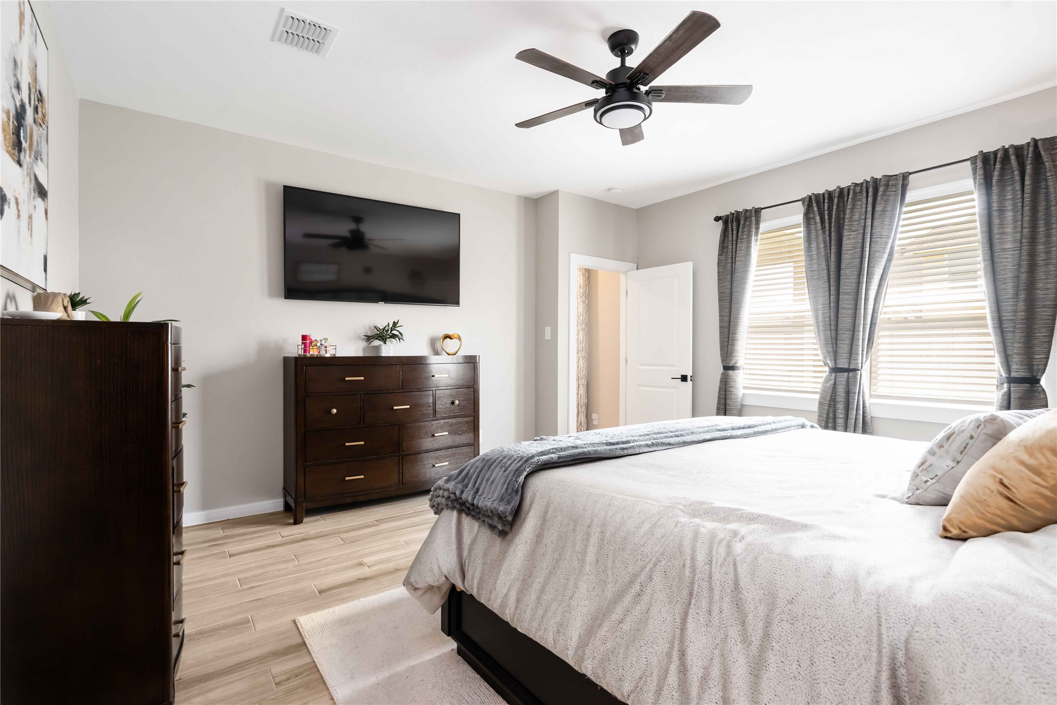 8414 Bay Rdg Circle Baytown, TX 77523 - Photo 12 of 35 a bedroom with a bed and a flat screen tv