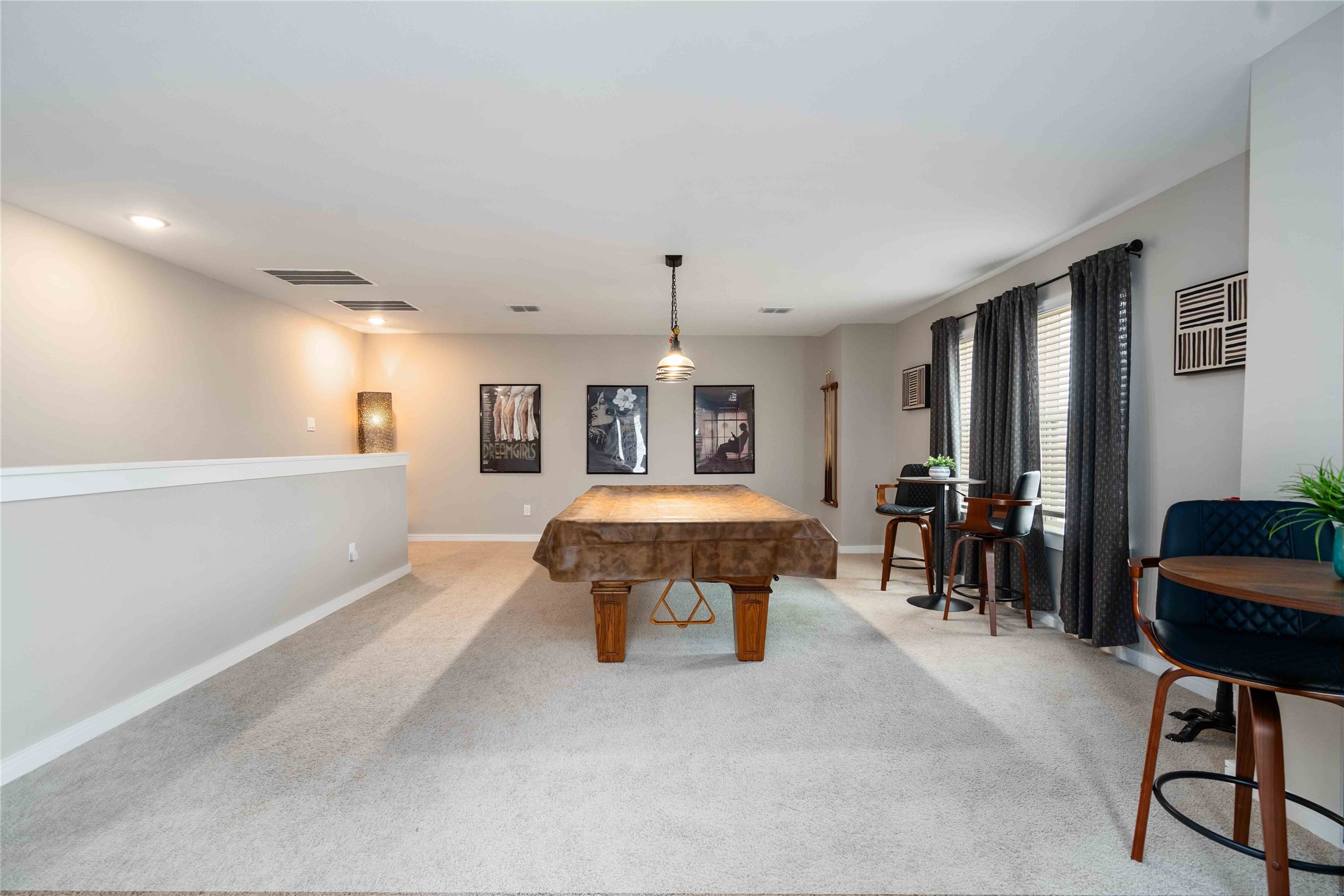 8414 Bay Rdg Circle Baytown, TX 77523 - Photo 17 of 35 a spacious bedroom with a bed a couch and a chandelier