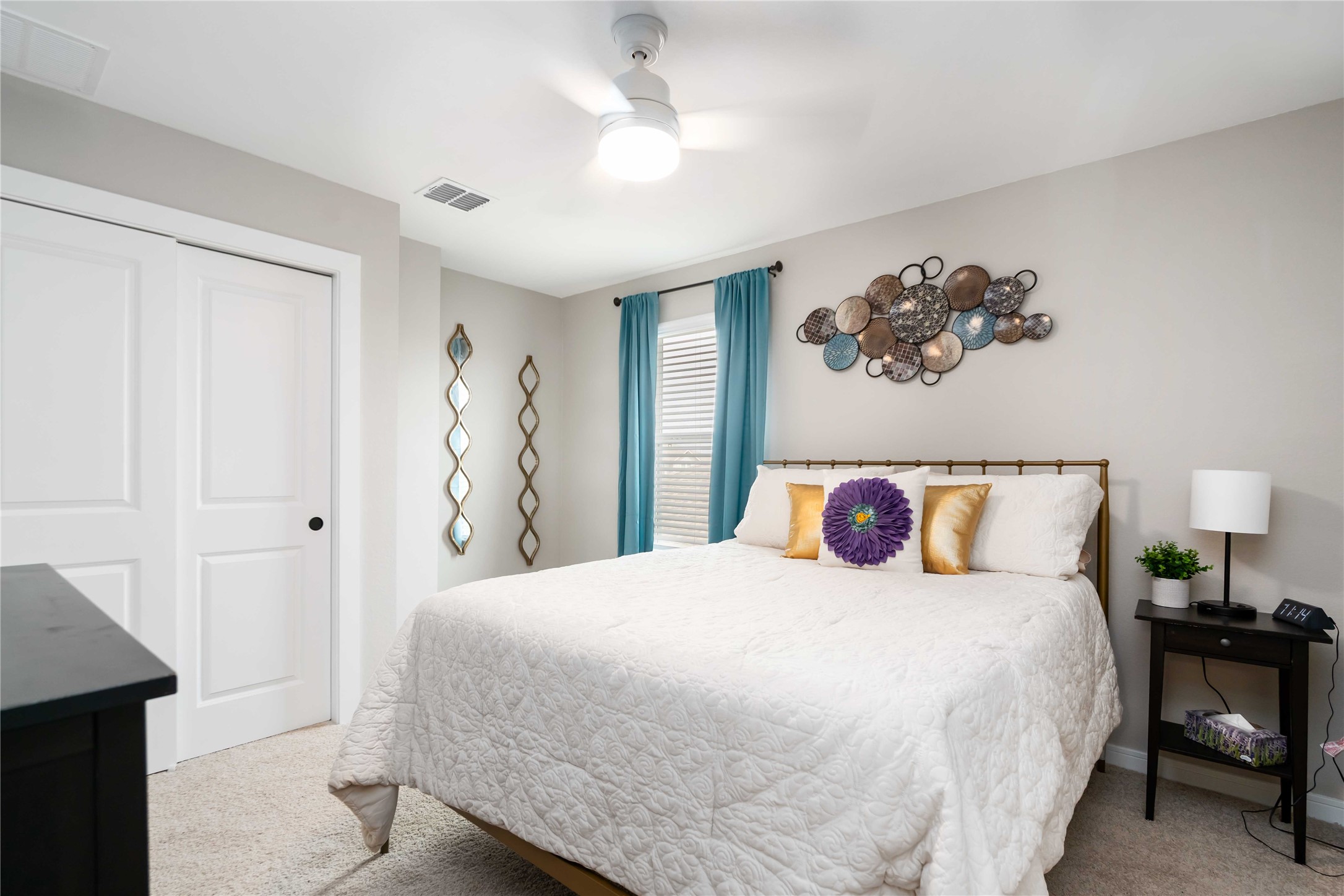 8414 Bay Rdg Circle Baytown, TX 77523 - Photo 20 of 35 a bedroom with a large bed and a chandelier