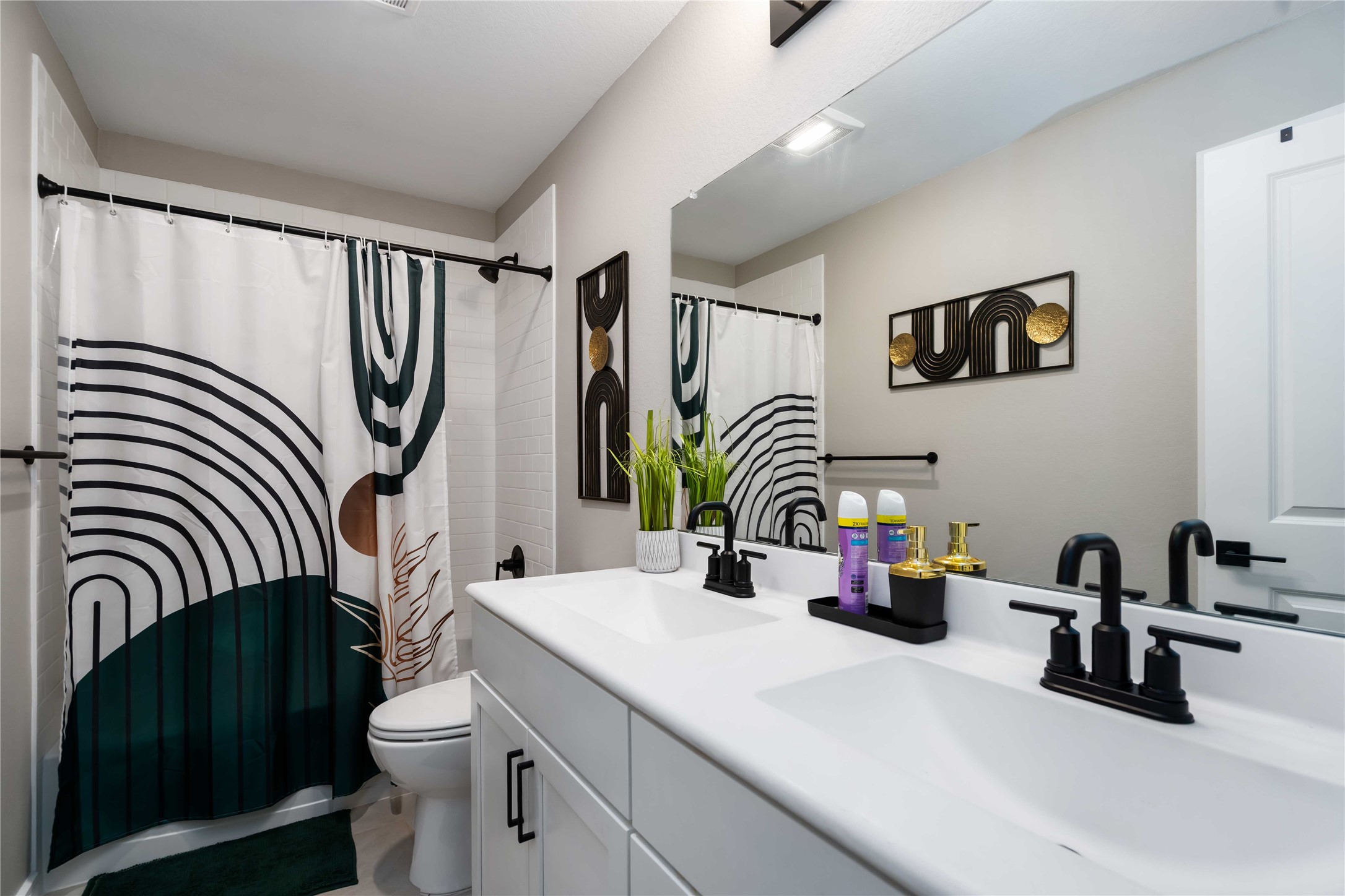 8414 Bay Rdg Circle Baytown, TX 77523 - Photo 24 of 35 a bathroom with a sink a toilet and a mirror
