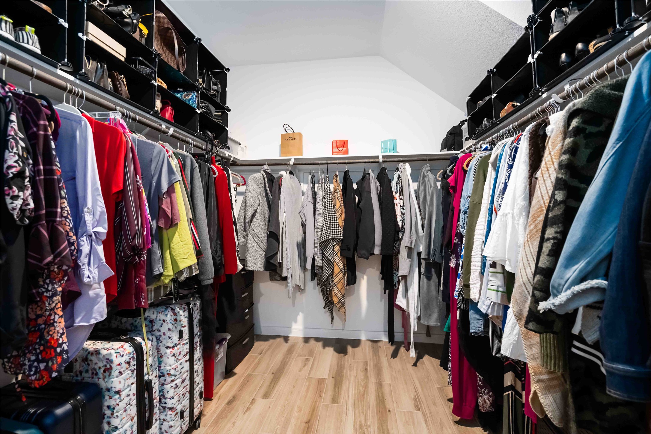 8414 Bay Rdg Circle Baytown, TX 77523 - Photo 28 of 35 a view of walk in closet with clothes and shoes