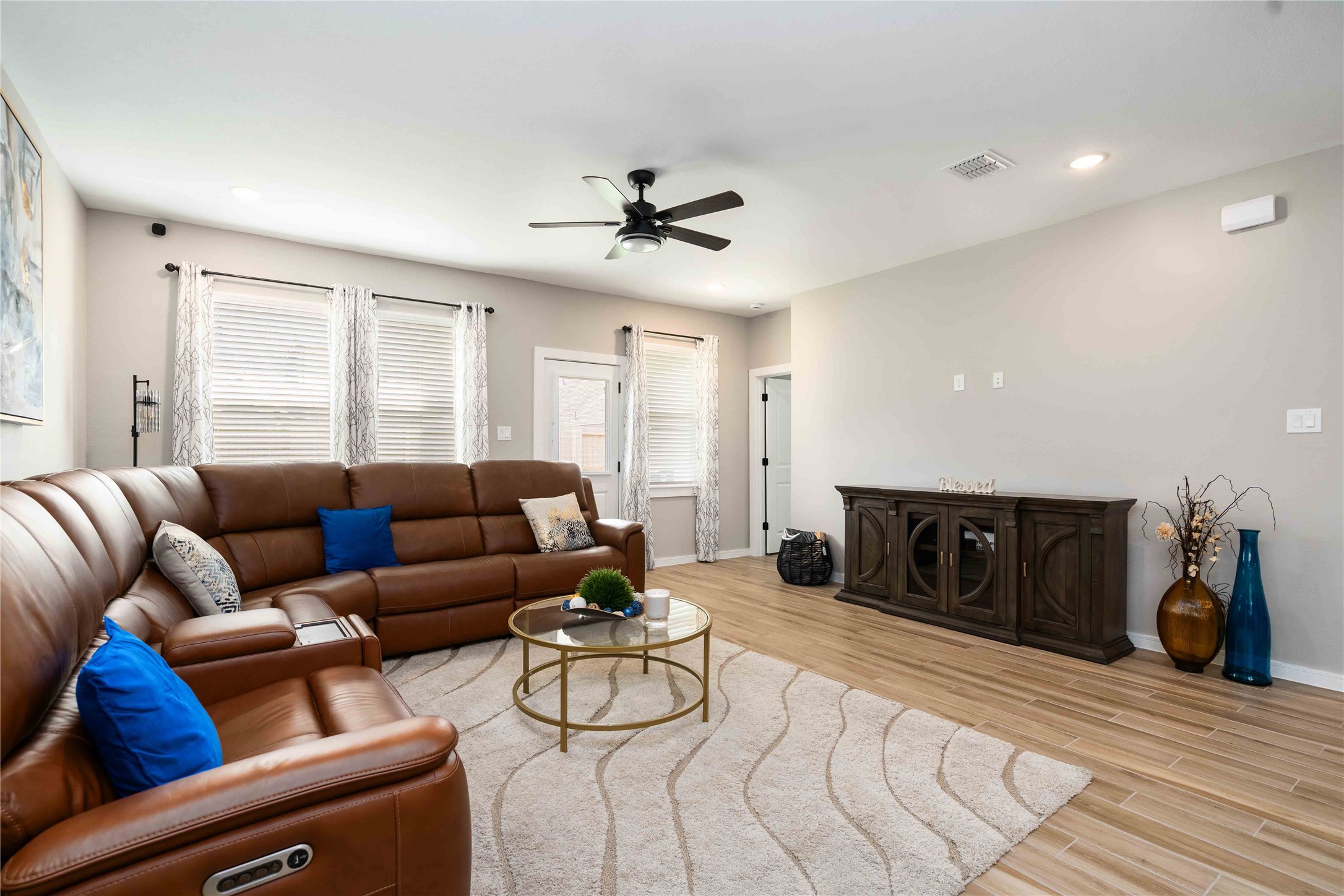 8414 Bay Rdg Circle Baytown, TX 77523 - Photo 5 of 35 a living room with furniture a ceiling fan and a rug