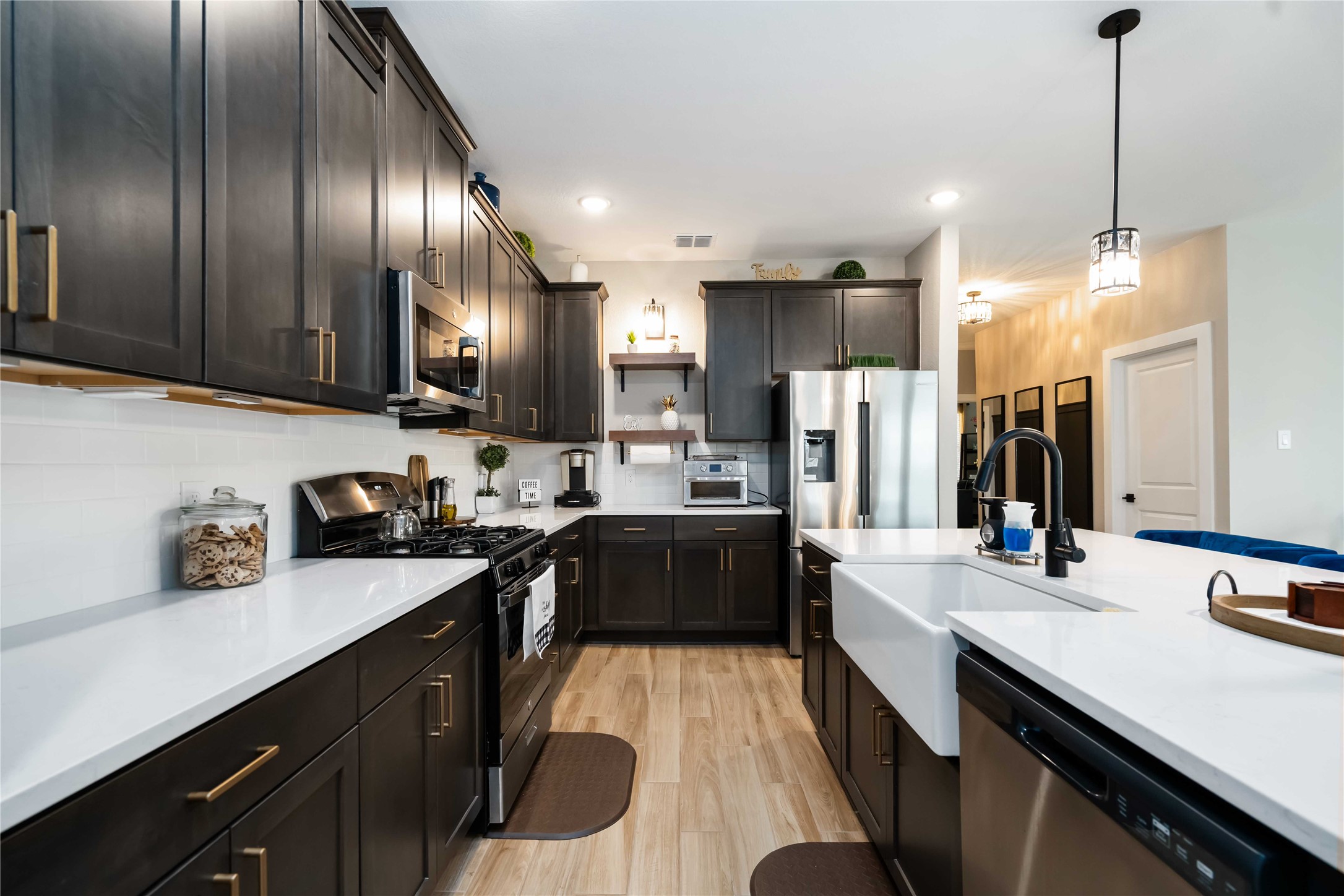 8414 Bay Rdg Circle Baytown, TX 77523 - Photo 9 of 35 a kitchen with stainless steel appliances granite countertop sink stove refrigerator and cabinets