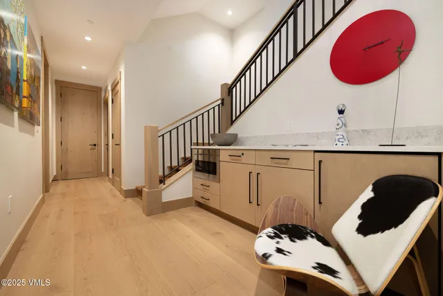 a view of a kitchen with a sink and living room
