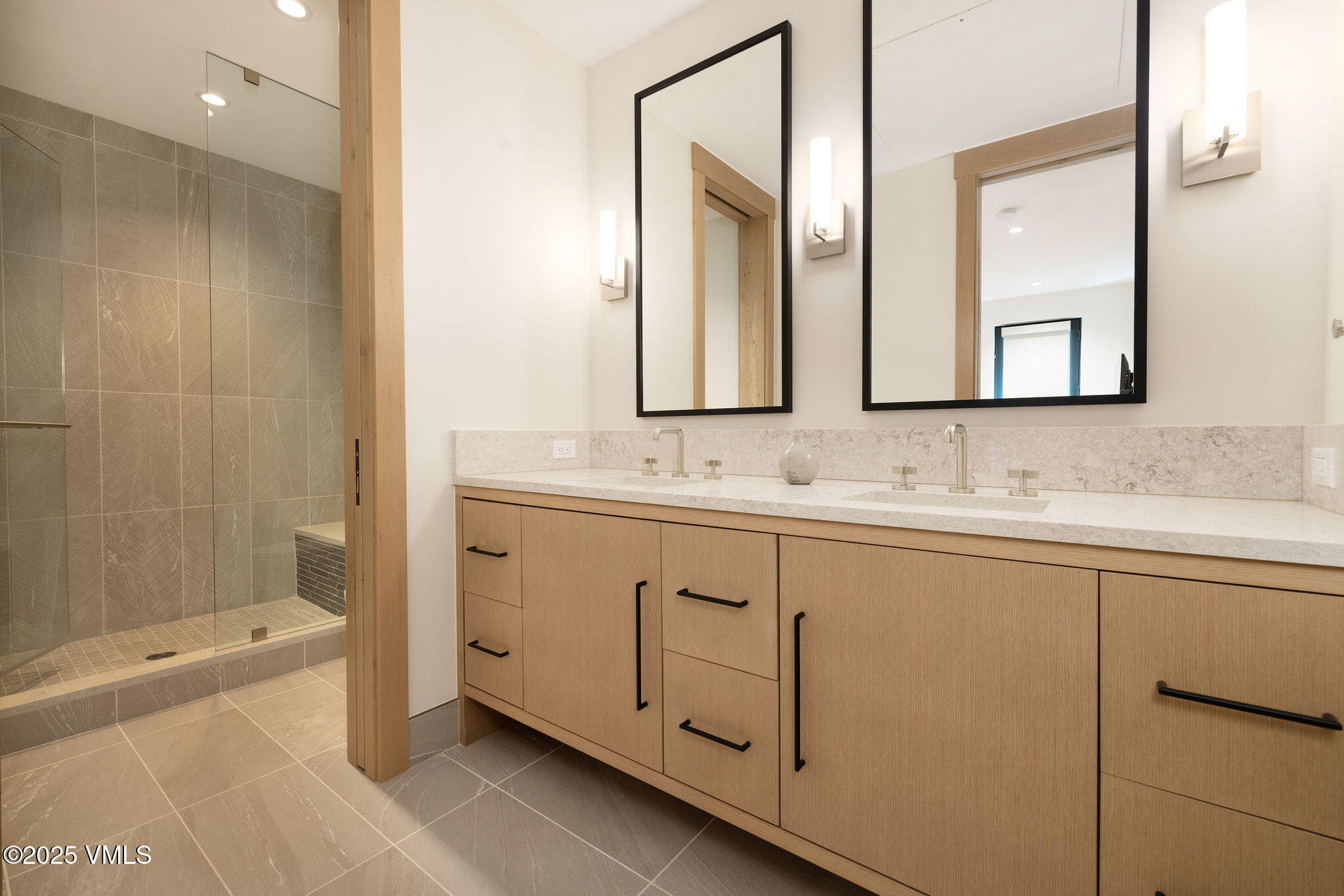 42 Riverfront Lane, Unit 2 Avon, CO 81620 - Photo 15 of 27 a bathroom with 2 sink tub and a mirror