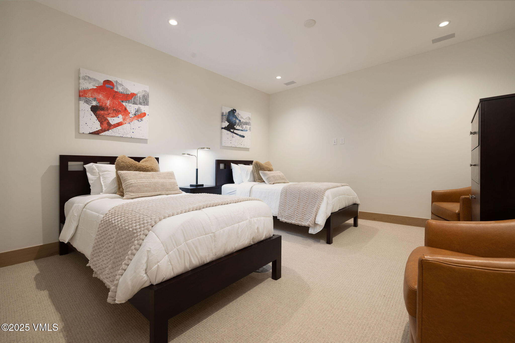 42 Riverfront Lane, Unit 2 Avon, CO 81620 - Photo 17 of 27 a bedroom with bed and a couch