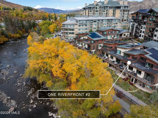 a street sign on a blue wall