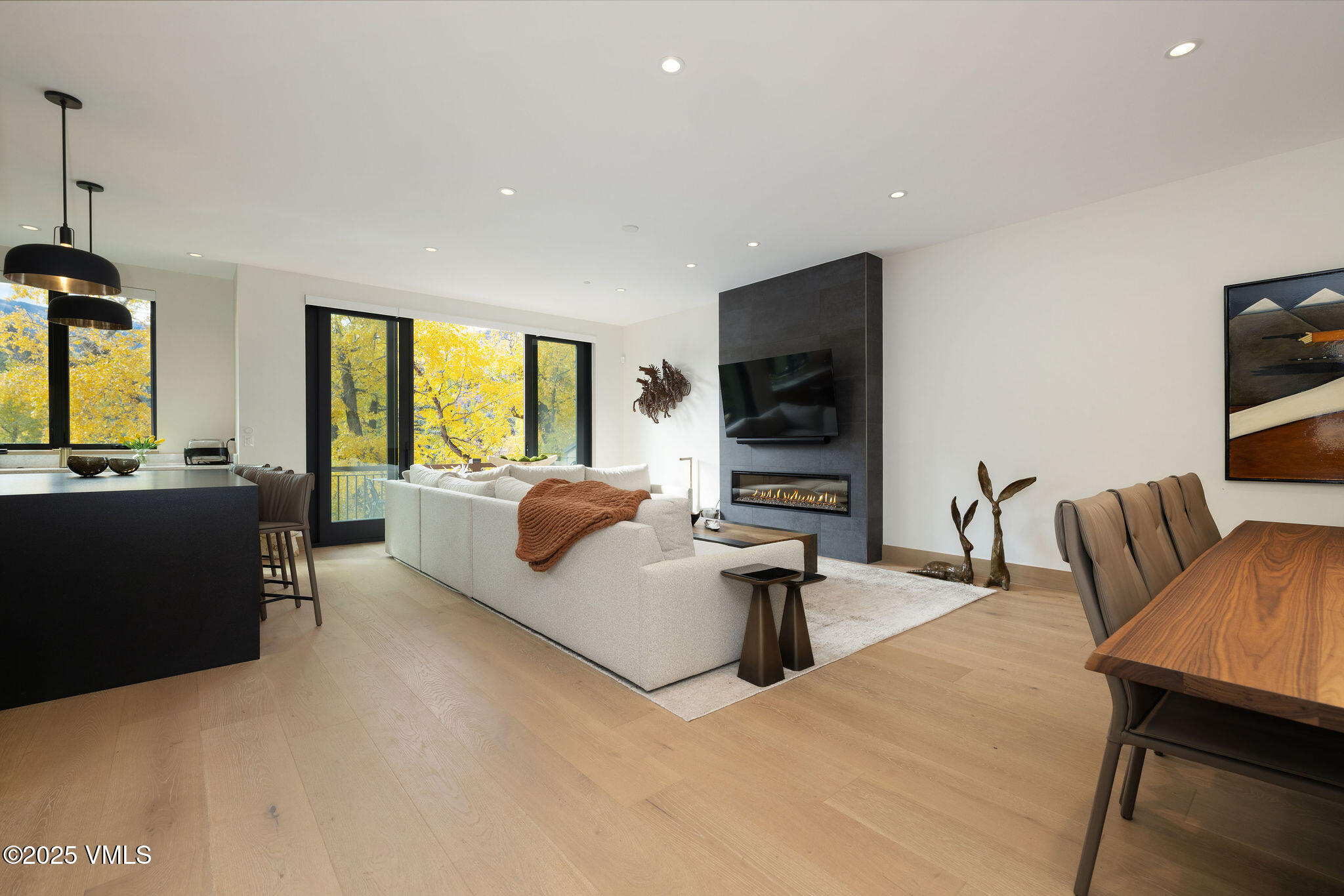 42 Riverfront Lane, Unit 2 Avon, CO 81620 - Photo 4 of 27 a living room with furniture and a flat screen tv