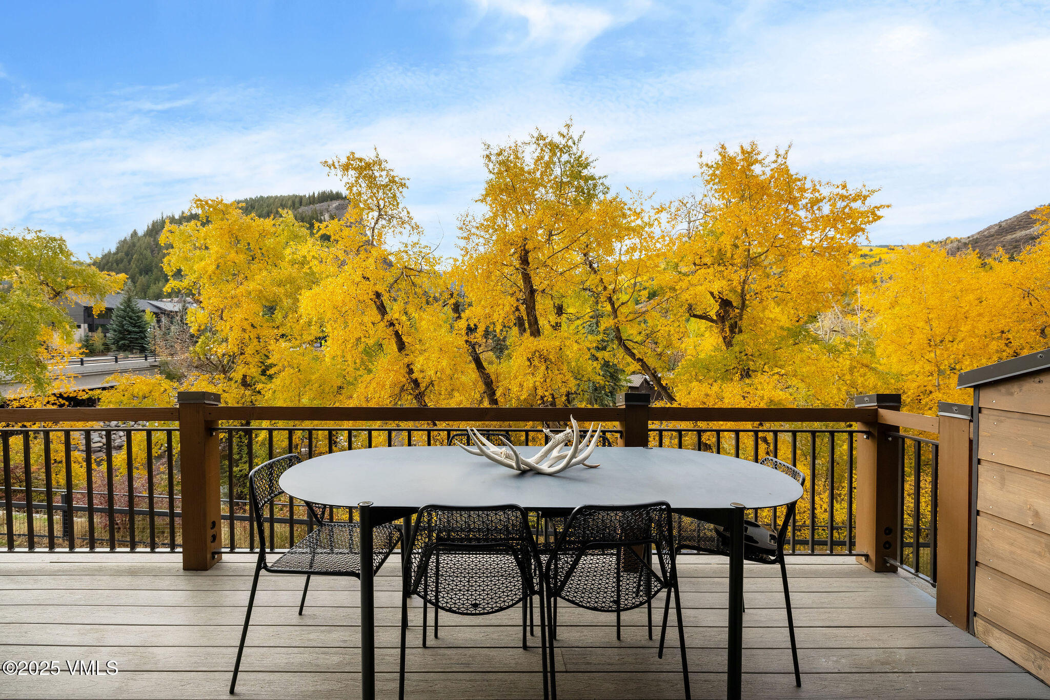 42 Riverfront Lane, Unit 2 Avon, CO 81620 - Photo 7 of 27 a view of a chairs and table on the deck