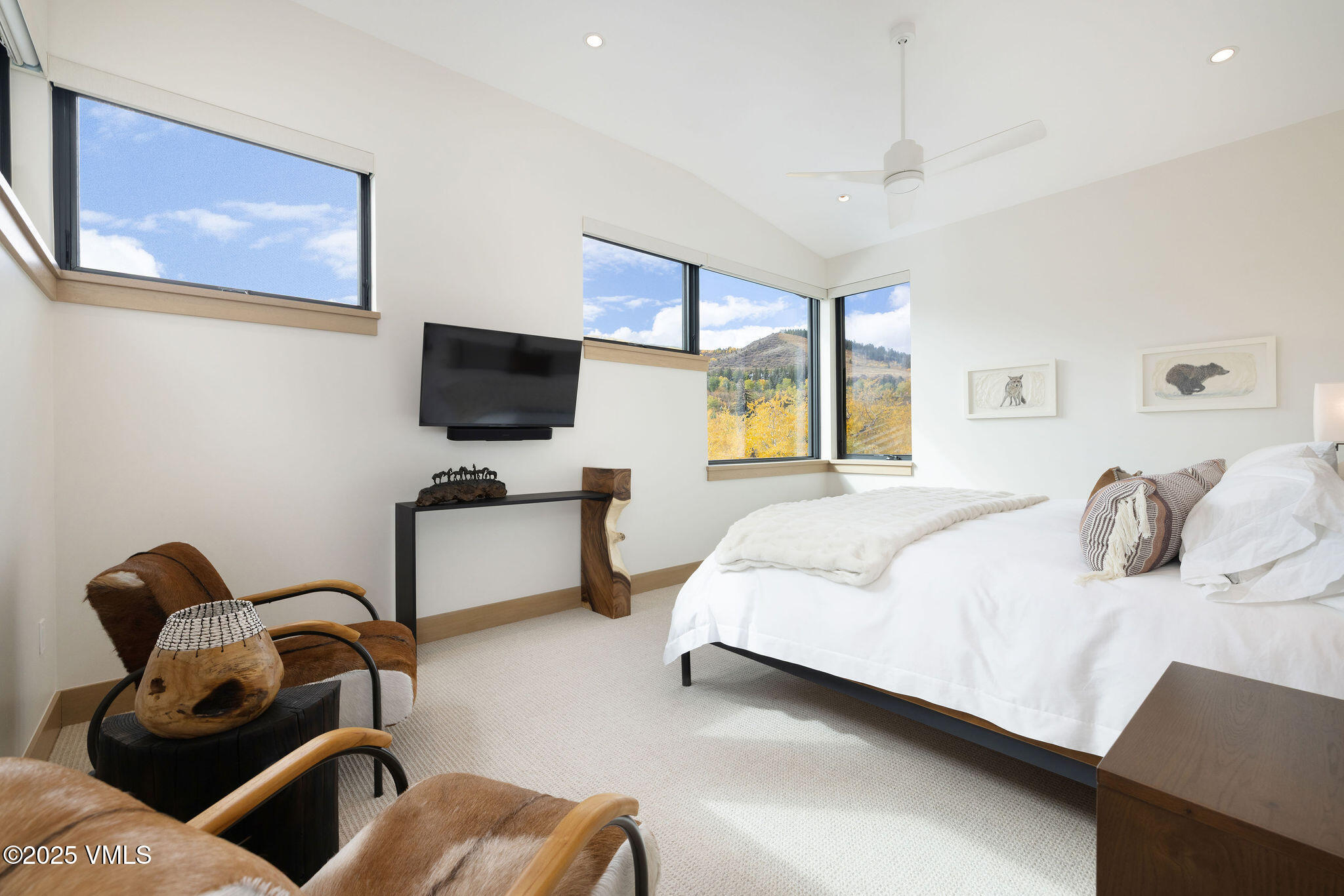 42 Riverfront Lane, Unit 2 Avon, CO 81620 - Photo 10 of 27 a bedroom with furniture and a flat screen tv