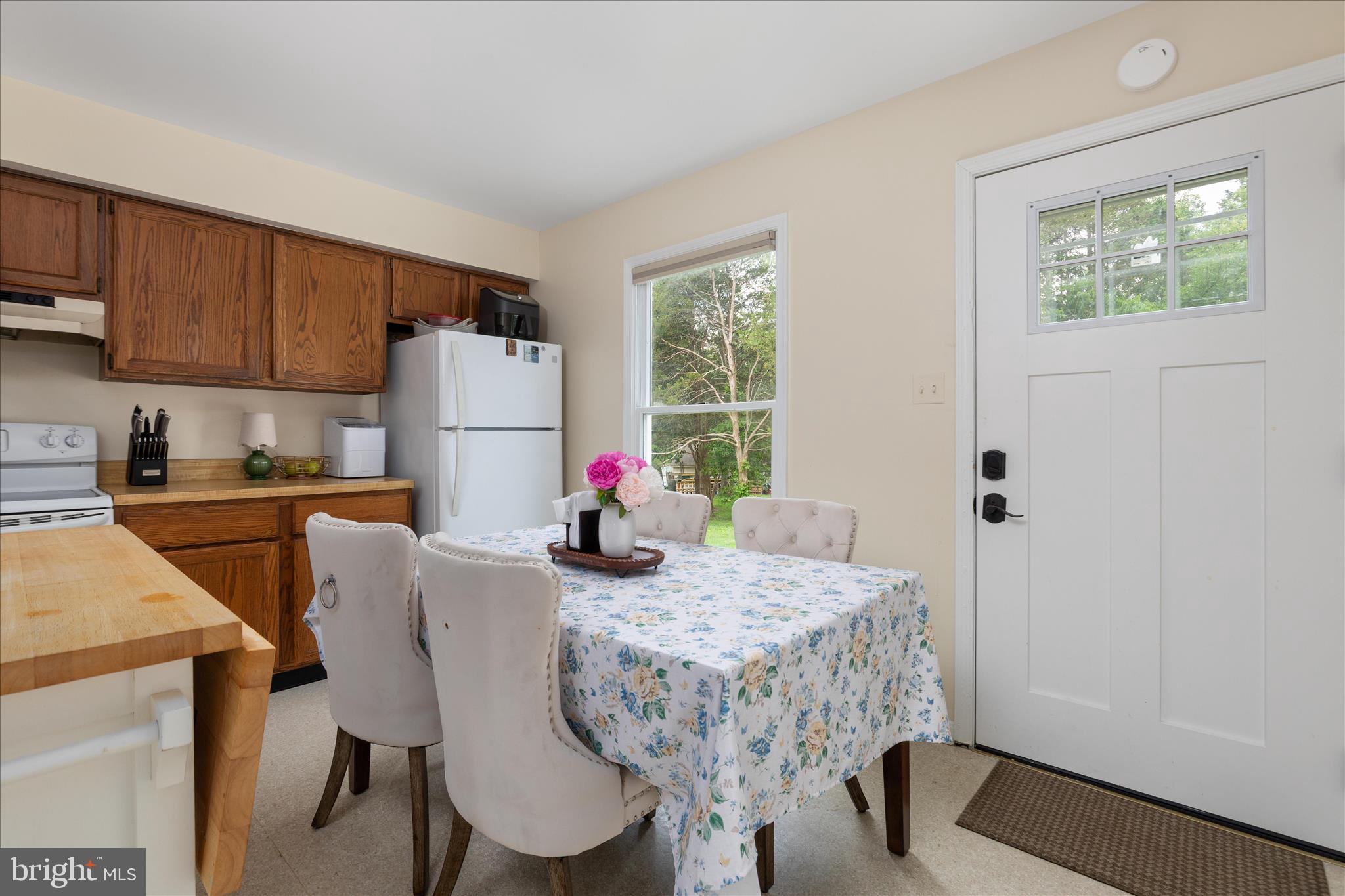 208 North Rappahannock Street Remington, VA 22734 - Photo 10 of 21 a view of a dining room with furniture and a window