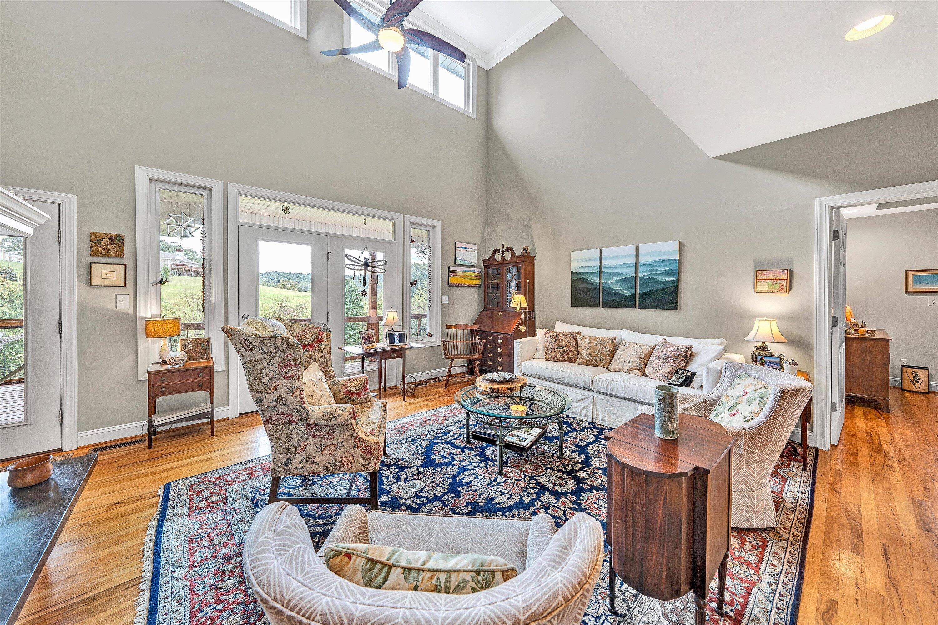 84 Green Level Road Boones Mill, VA 24065 - Photo 12 of 56 a living room with furniture kitchen view and large windows