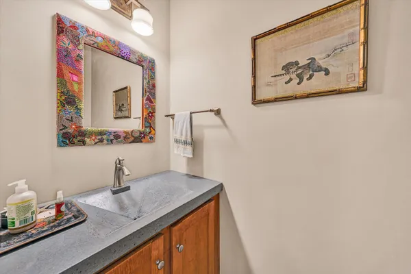 a bathroom with a sink and a mirror