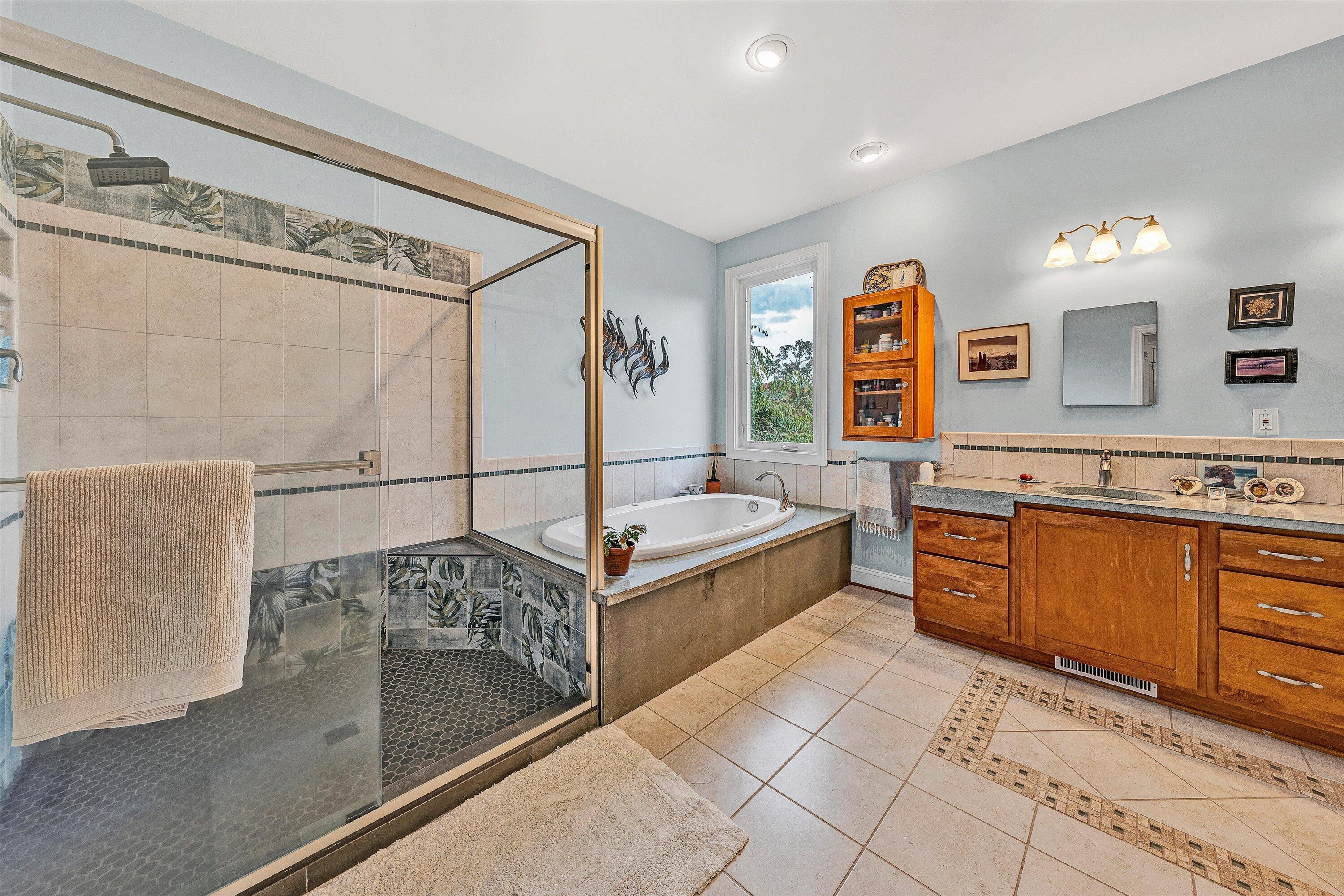 84 Green Level Road Boones Mill, VA 24065 - Photo 26 of 56 a spacious bathroom with a tub sink and mirror