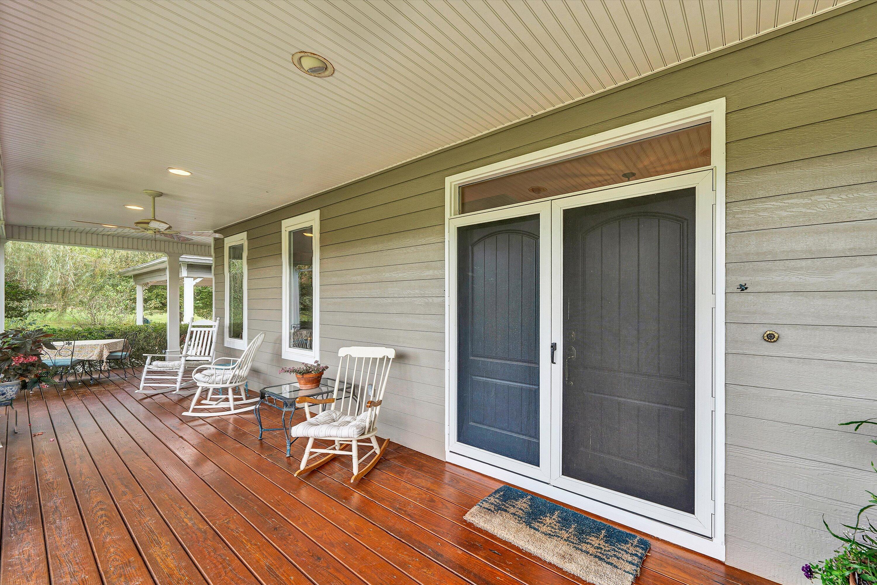 84 Green Level Road Boones Mill, VA 24065 - Photo 51 of 56 a view of a patio with table and chairs and wooden floor