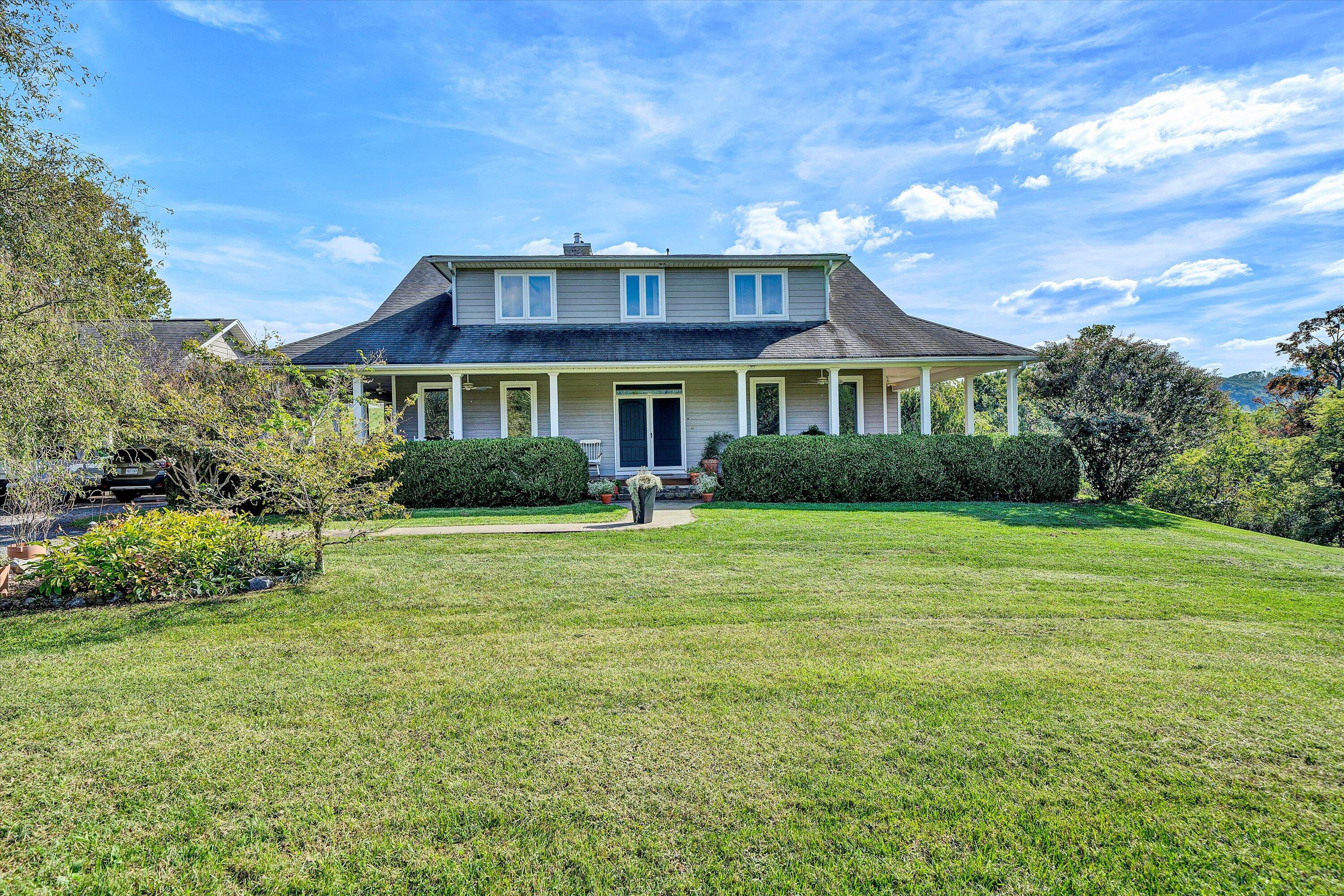 84 Green Level Road Boones Mill, VA 24065 - Photo 54 of 56 a front view of a house with a yard