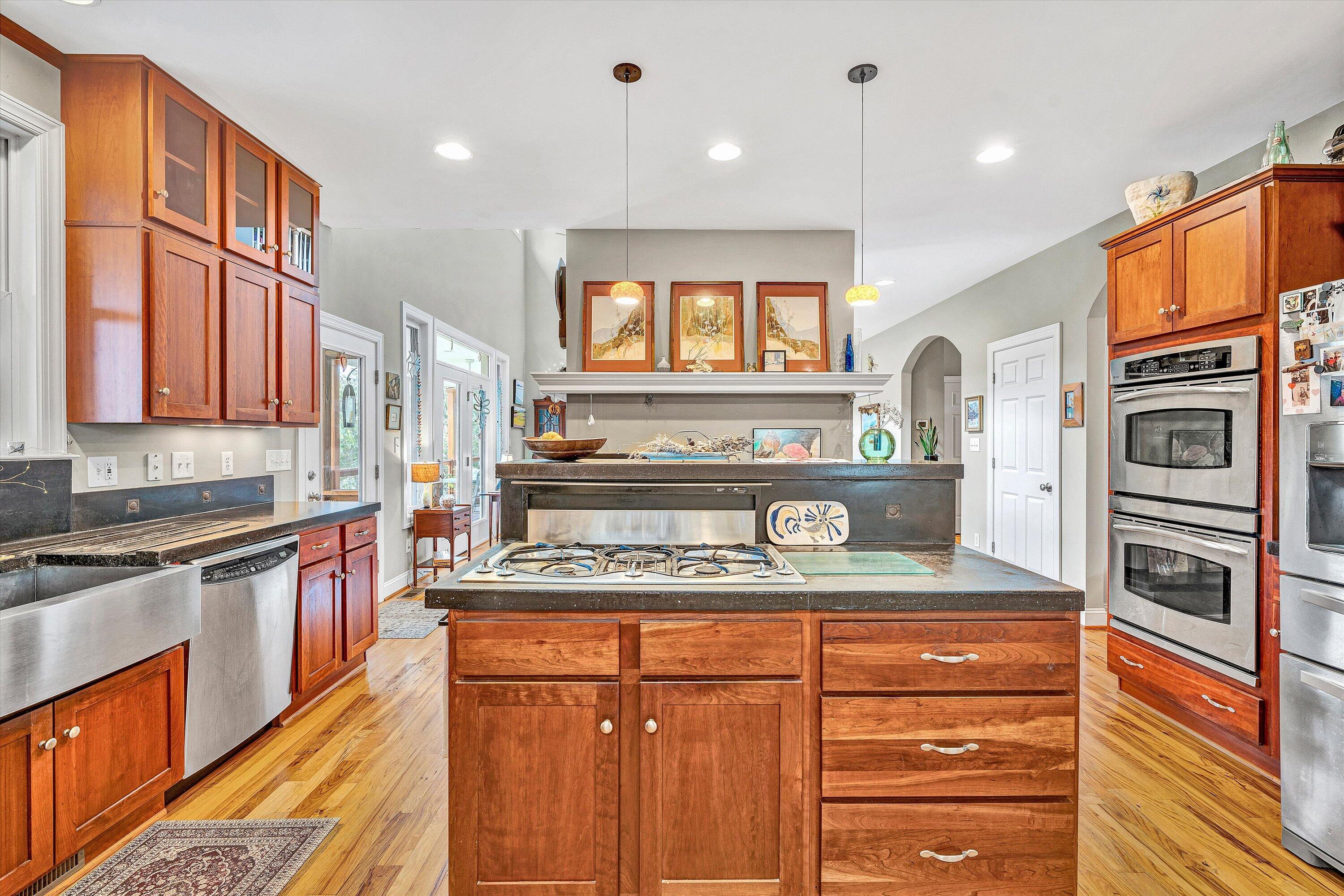 84 Green Level Road Boones Mill, VA 24065 - Photo 10 of 56 a kitchen with stainless steel appliances granite countertop a stove and cabinets