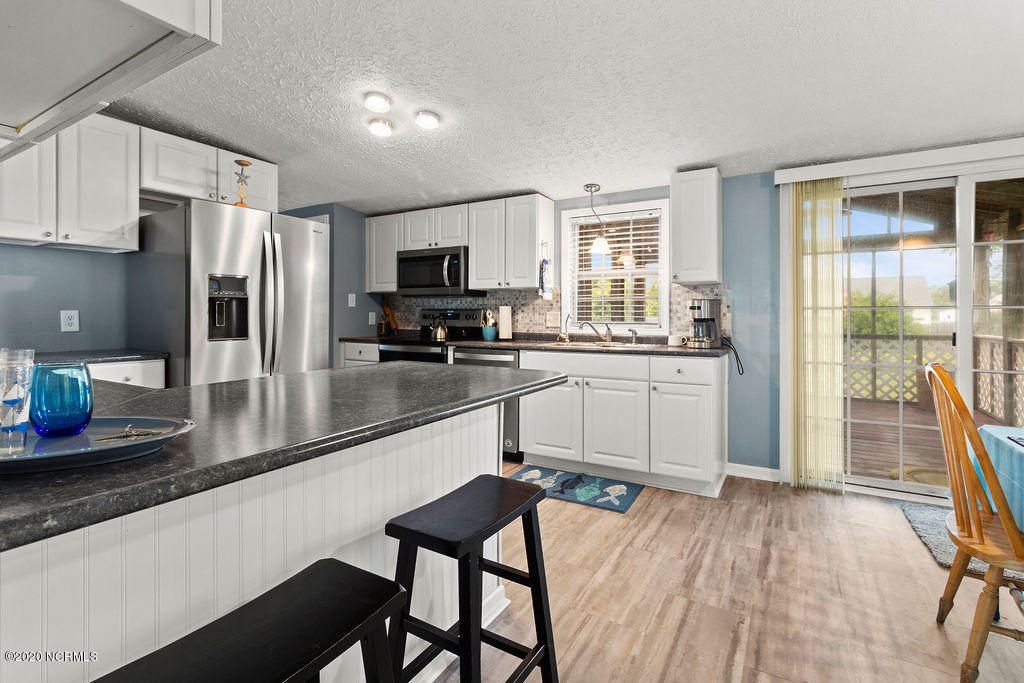 1340 Nine Foot Road Newport, NC 28570 - Photo 9 of 25 Kitchen looking out to enclosed porch