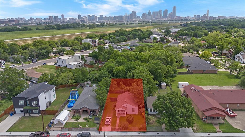 an aerial view of residential houses with outdoor space and river