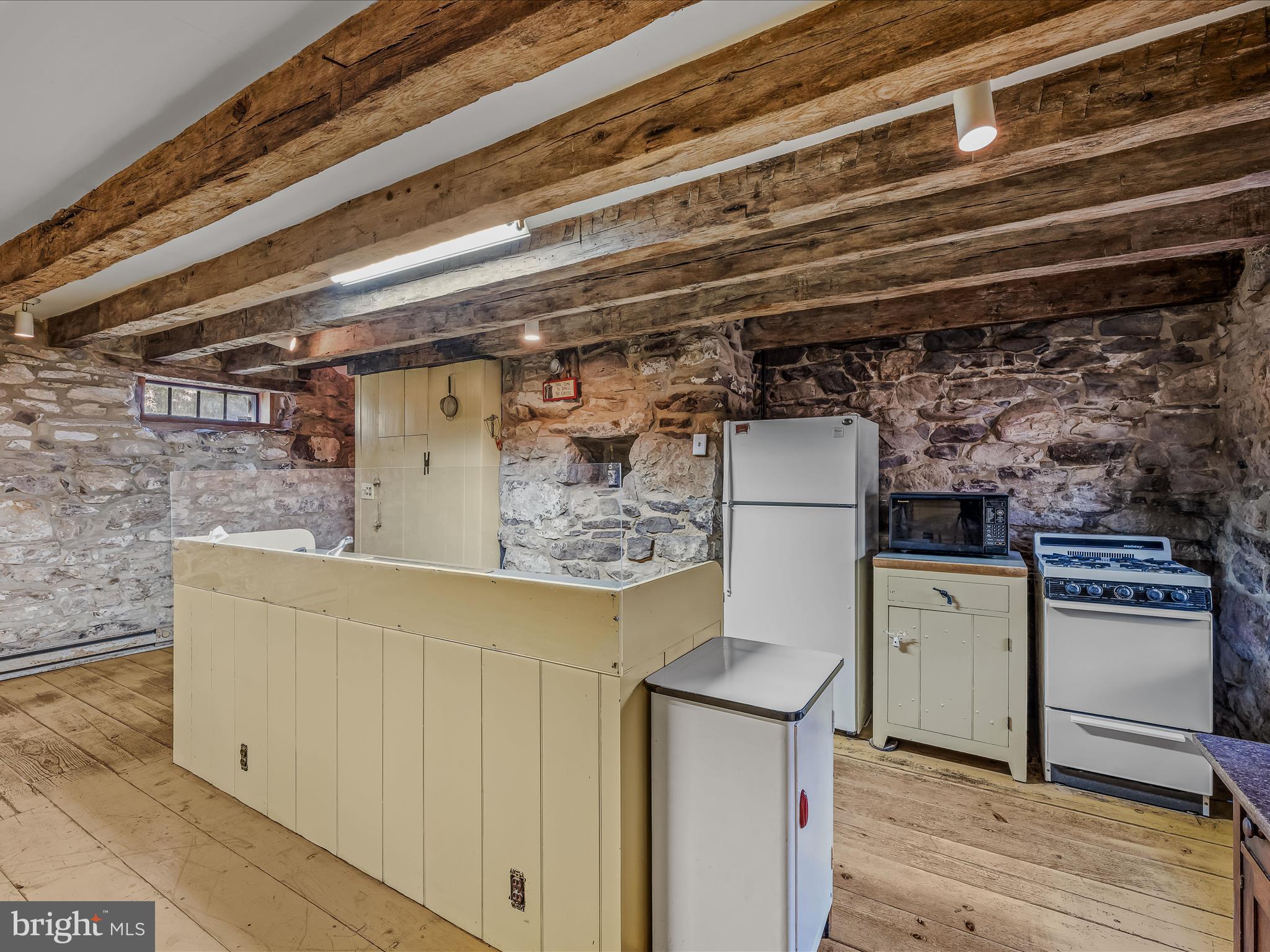 1646 Gerrardstown Road Gerrardstown, WV 25420 - Photo 12 of 37 a view of a refrigerator in kitchen and an empty room