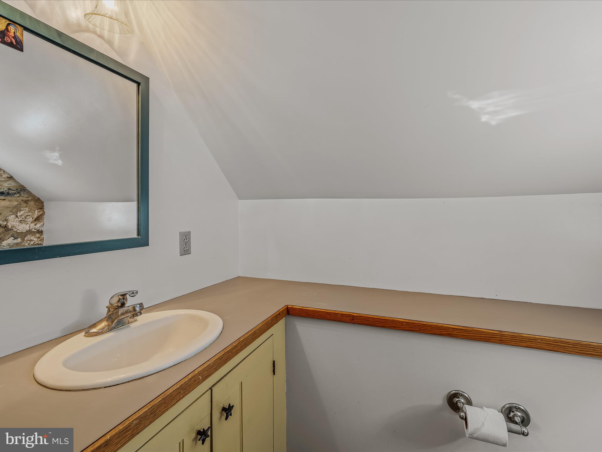 1646 Gerrardstown Road Gerrardstown, WV 25420 - Photo 18 of 37 a bathroom with a sink and a mirror