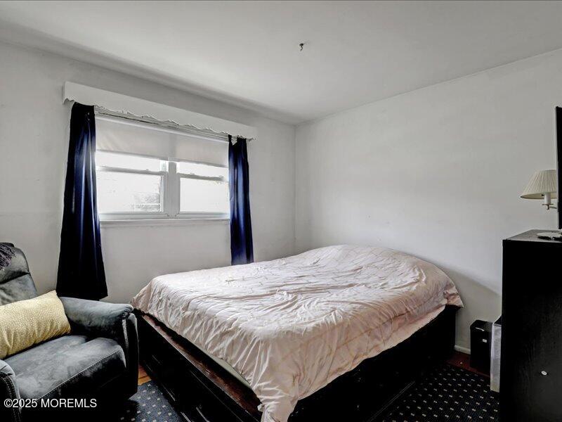 4 Knoll Terrace Hazlet, NJ 07730 - Photo 17 of 43 a bedroom with a bed and wooden floor