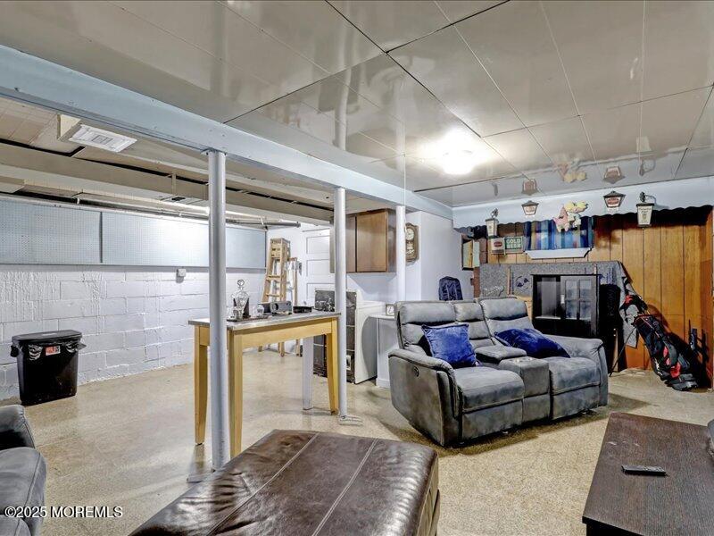 4 Knoll Terrace Hazlet, NJ 07730 - Photo 29 of 43 a living room with furniture and a kitchen view