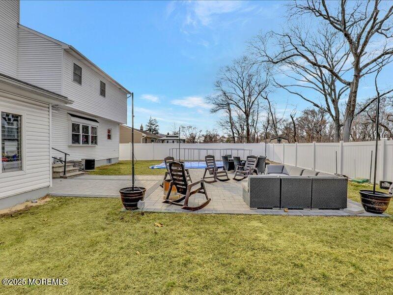 4 Knoll Terrace Hazlet, NJ 07730 - Photo 36 of 43 a view of a patio with table and chairs with wooden fence and plants
