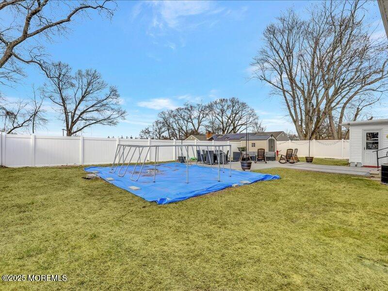 4 Knoll Terrace Hazlet, NJ 07730 - Photo 37 of 43 a view of a swimming pool with an outdoor space and seating area