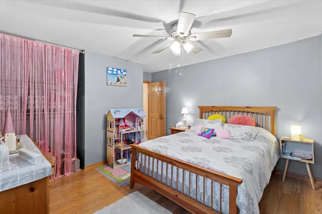 a bedroom that has a bed and a chandelier