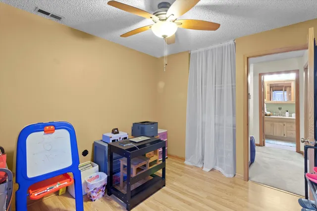 a view of a workspace with furniture and closet