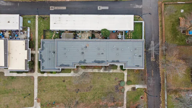 an aerial view of a house with a garden