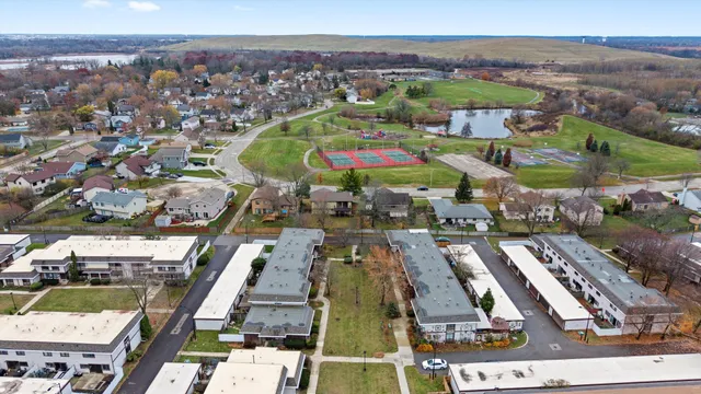an aerial view of residential houses with outdoor space