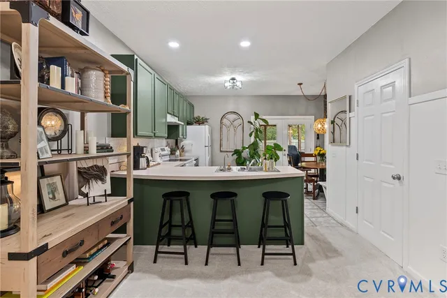 a kitchen with a refrigerator and a sink